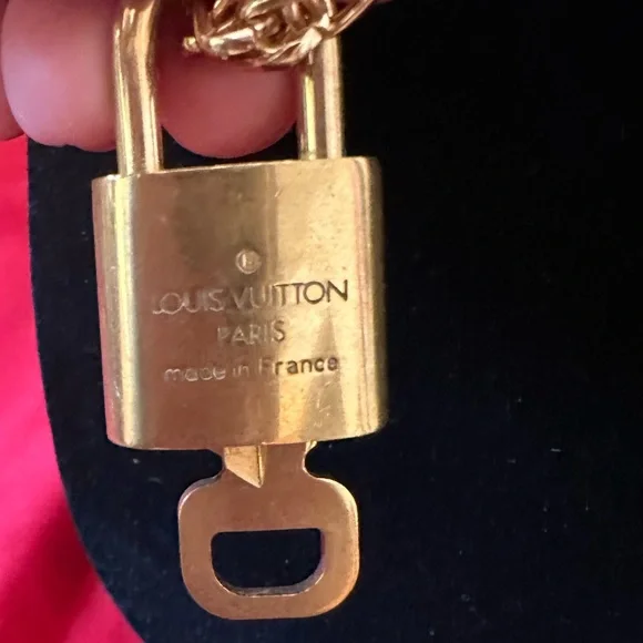 Authentic Louis Vuitton lock and key #308
with unbranded chain and earrings. - Picture 4 of 5